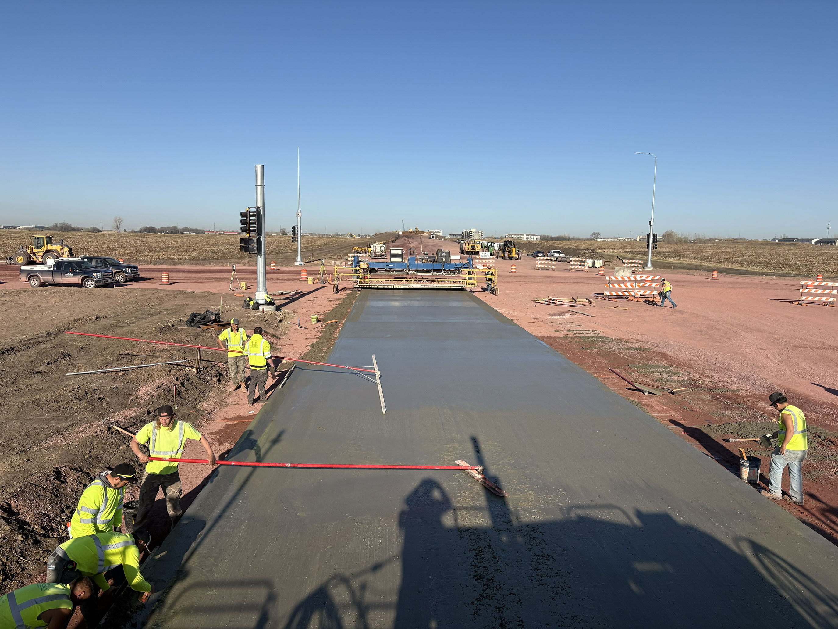 Workers pouring concrete.
