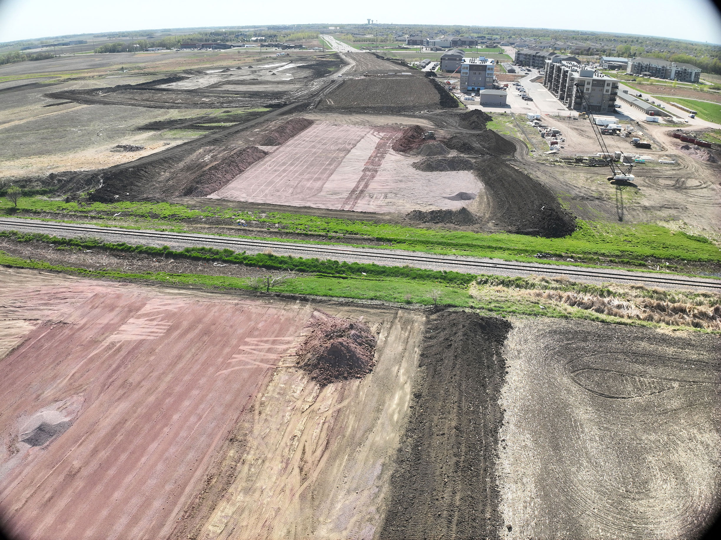 Aerial view of railroad near construction site.